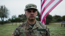 American Serviceman Military Salutes At Cemetery For Memorial Day