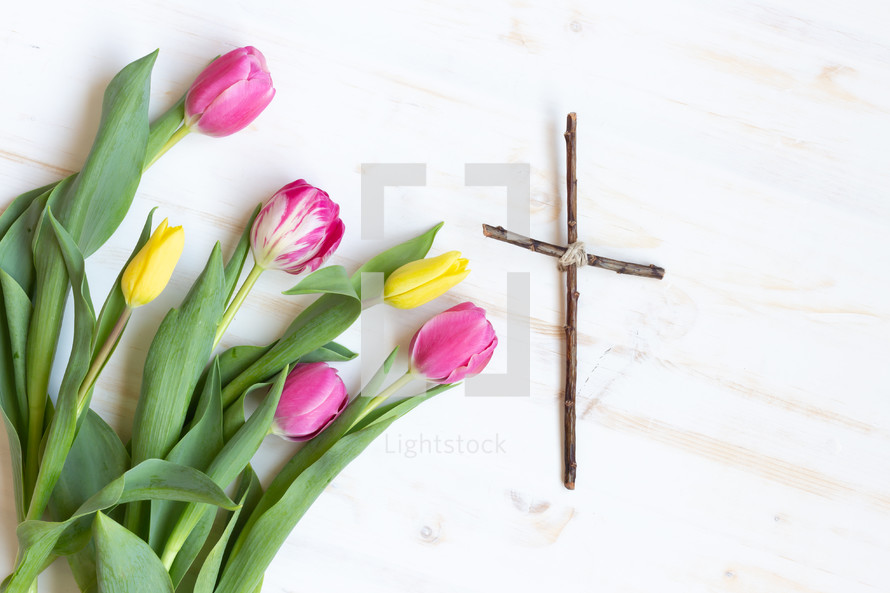 tulips and a cross made of sticks 