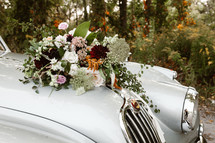 bridal bouquet on a vintage car 