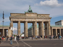 BERLIN, GERMANY - MAY 09, 2014: Tourists visiting the Brandenburger Tor (Brandenburg Gate) linking East and West Berlin