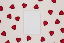 red heart shaped chocolates and white paper 