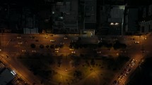 Descending top down shot of traffic on mainroad in Quito City during night,Ecuador	