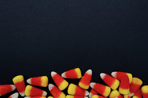 candy corn on a black background 
