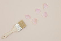 paint brush and pink petals 