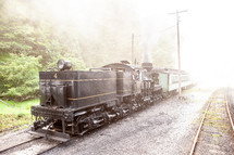Old black train locomotive on scenic railway