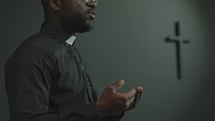 Black Catholic Priest Giving Speech on Liturgical Service in Church