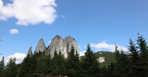 Timelapse of Sandstone And Limestone Massif Of Hasmas Mountains In The Romanian Carpathian Mountain Range Near Piatra Singuratica In Romania.