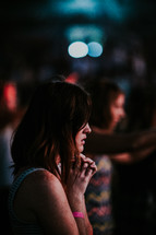 praying during a Christian concert 