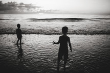 kids playing on a beach 