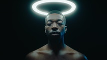 Black Man Posing with Ring Light above the Head