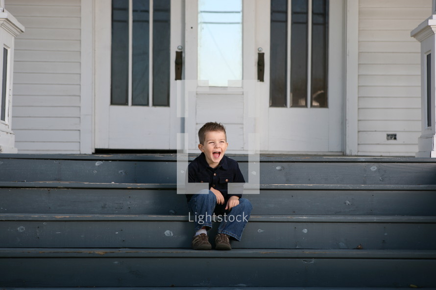  boy sitting on stairs