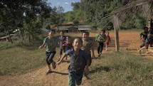 Asian Children Running In Mountain Village