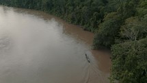 Aerial View Of Boat On A River In The Green Jungle Of Ecuador. 
