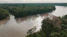 Drone Fly Over Amazon River With Sailboat Across Exotic Jungle In Ecuador.