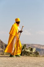 priest walking in the desert in Ethiopia 
