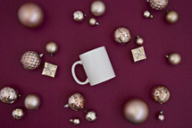 gold Christmas ornaments and mug 