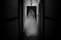 a bride walking down a hallway 