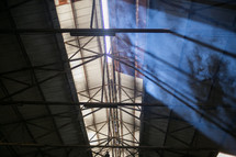 rays of sunlight through dust in a factory 