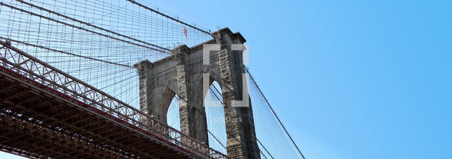 A shot below of the Brooklyn bridge