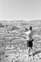 man taking a picture of the Australian outback 