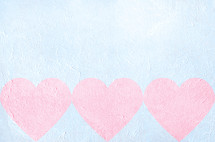 light pink hearts on light blue textural gesso background