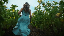 Running through sunflowers in dress ( FPV Drone)