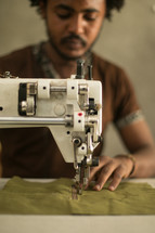 man at a sewing machine 