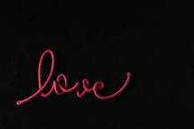 word love on a black background 