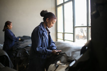 women cutting leather in a factory in Kenya 