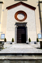 entrance to an old church in Italy in the Crugnola 