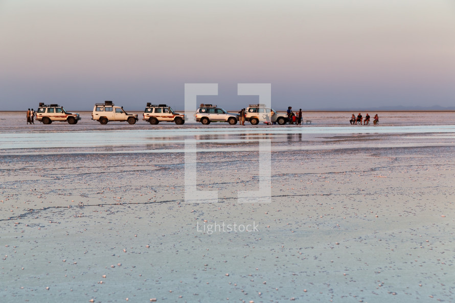 vehicles on a salt lake shore in Ethiopia 