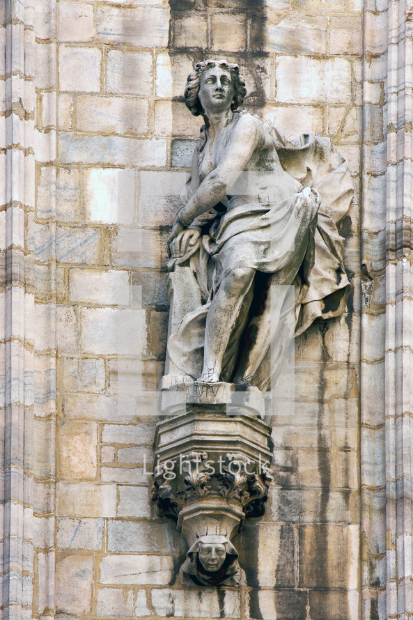 lady statue in Italy on a cathedral in Milan 