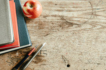 red, navy, gray books, apple and pens 2 and cross