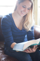 a woman reading Bible at a Bible study 