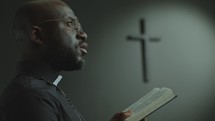 Pastor Preaching a Sermon with Bible in Modern Catholic Church
