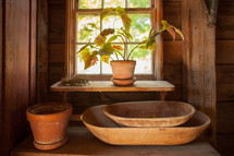old wooden bowls in a window 