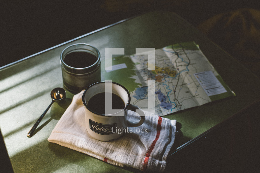 mug and map on a table in a camper 