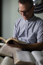 A priest reading a Bible 