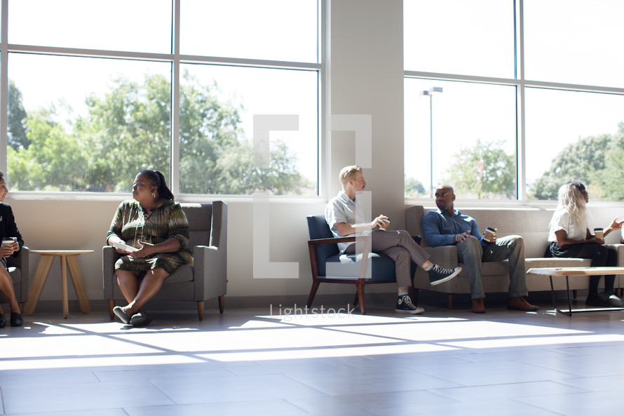 conversations in the lobby of the Harvest Church building 