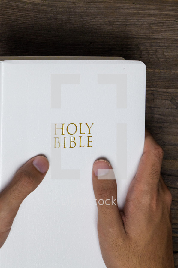 man holding a Bible 