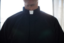 A minister in a clerical collar.