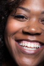 closeup of the face of a smiling woman 