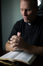 A priest in prayer