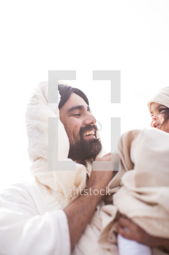 Jesus holding a child 