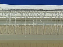 Icicles hanging off a gutter. 
