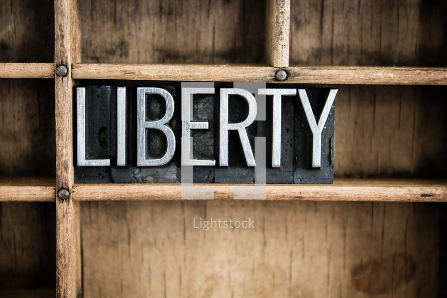 word liberty on a shelf 