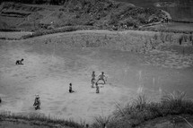 children playing on a shore in Luwuk 