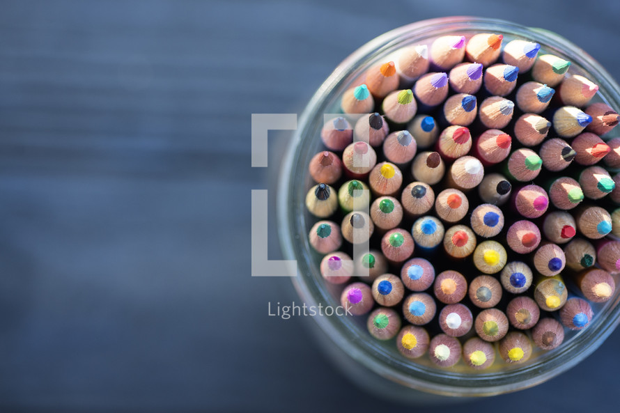 sharpened colored pencils in a mason jar 