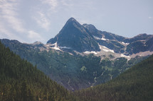 Mountain peaks rising above surrounding mountains.