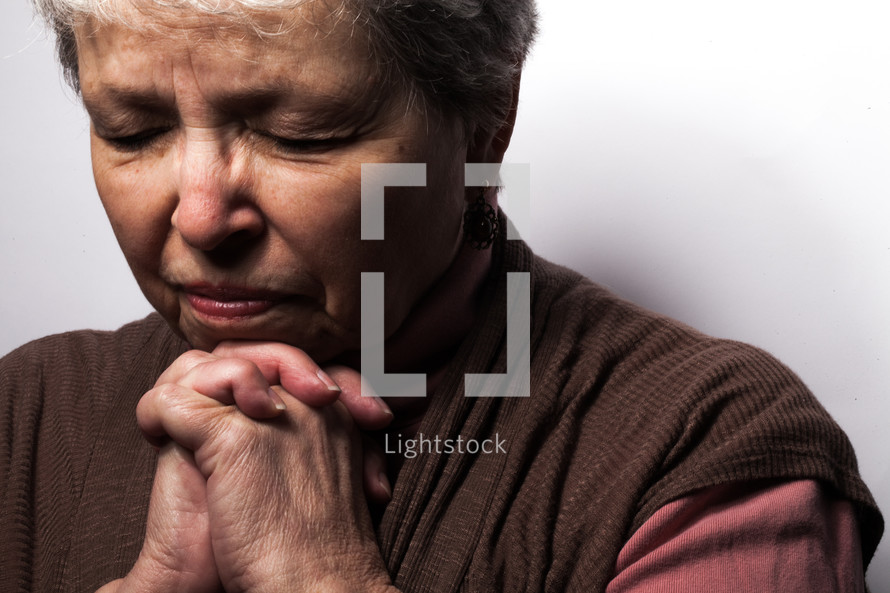 headshot of a woman in prayer